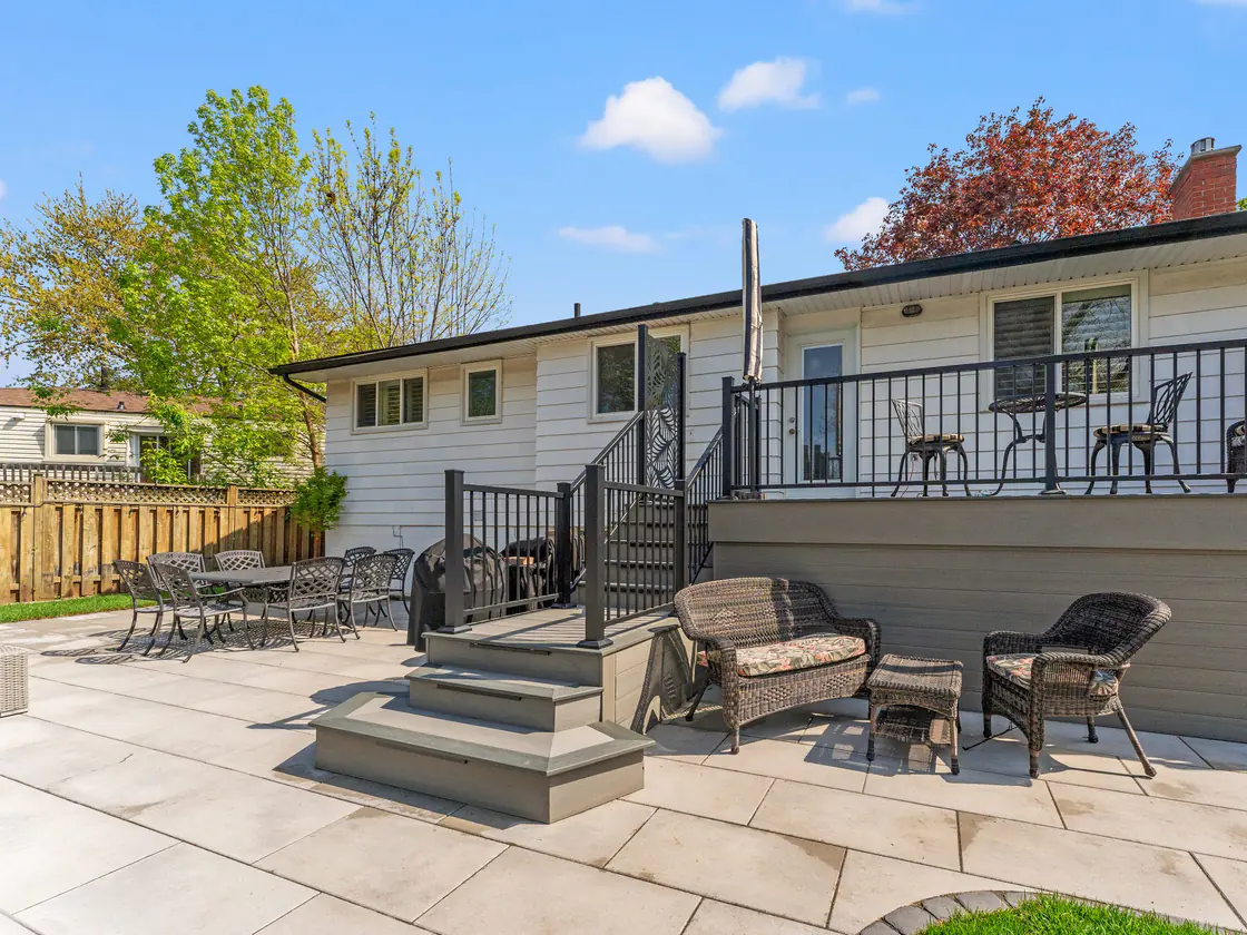Raised rear deck with a new black aluminum railing