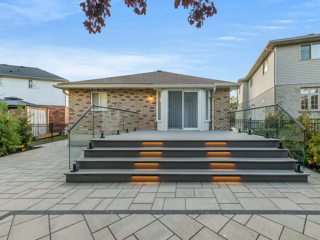 Wide deck stairs with glass guards and step lighting