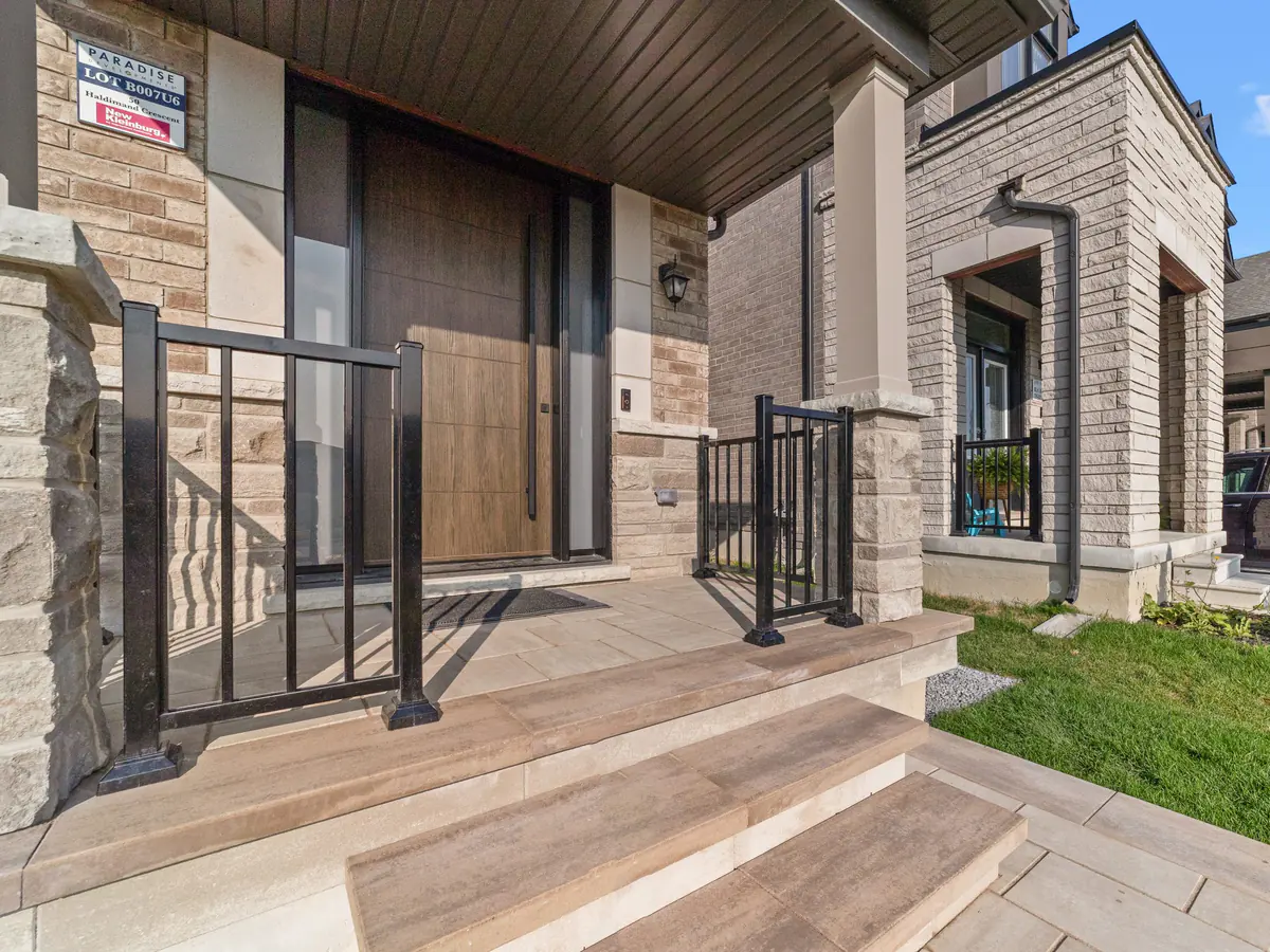 Black aluminum guards framing a front door
